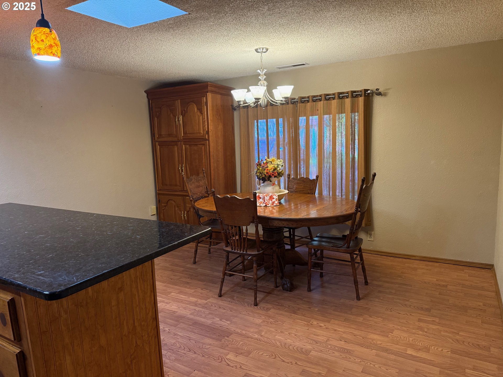 87511 Tiernan Road Mapleton, OR 97453 - Photo 6 of 23 a view of a dining room with furniture and chandelier