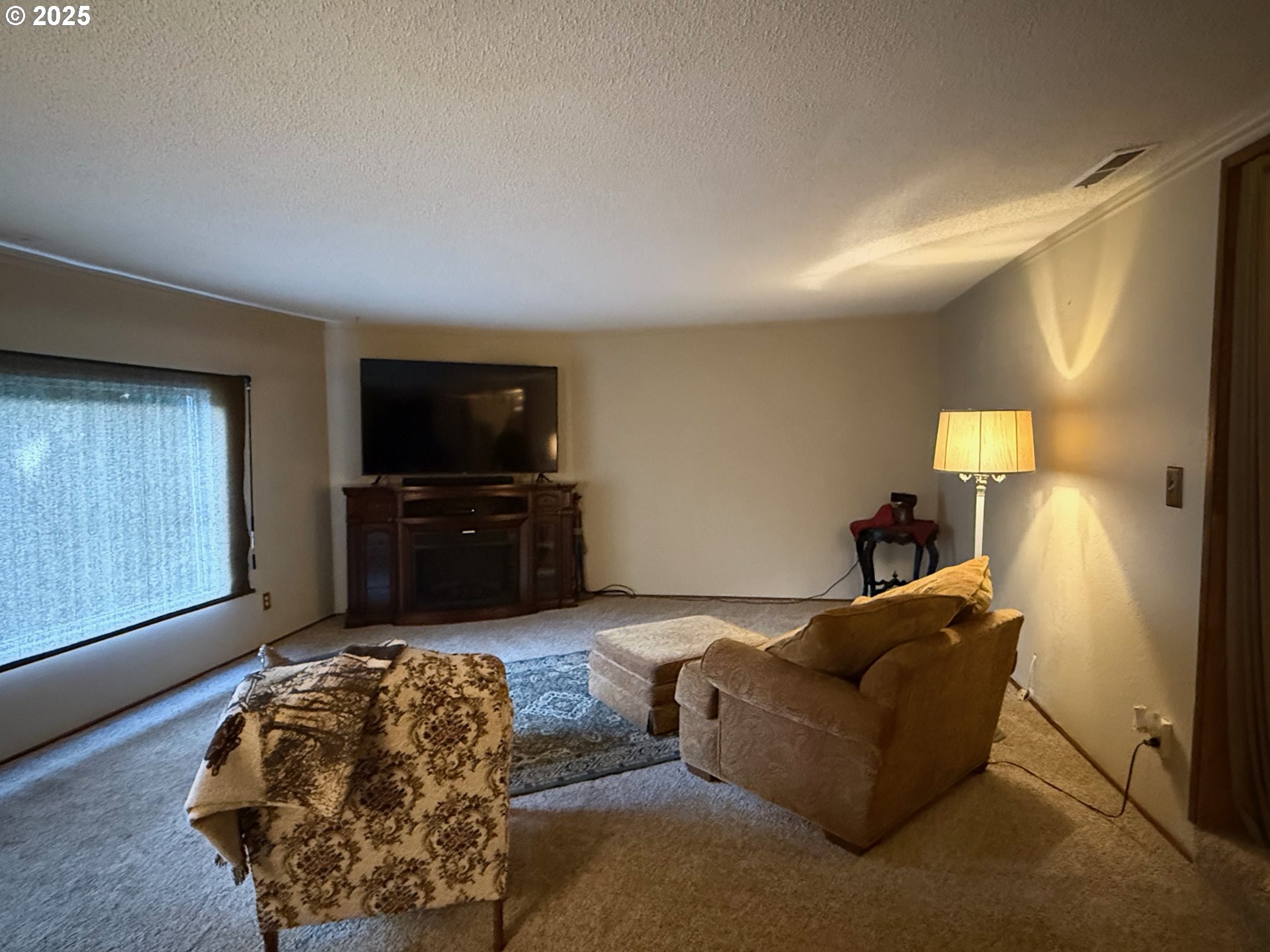 87511 Tiernan Road Mapleton, OR 97453 - Photo 9 of 23 a living room with furniture and a flat screen tv