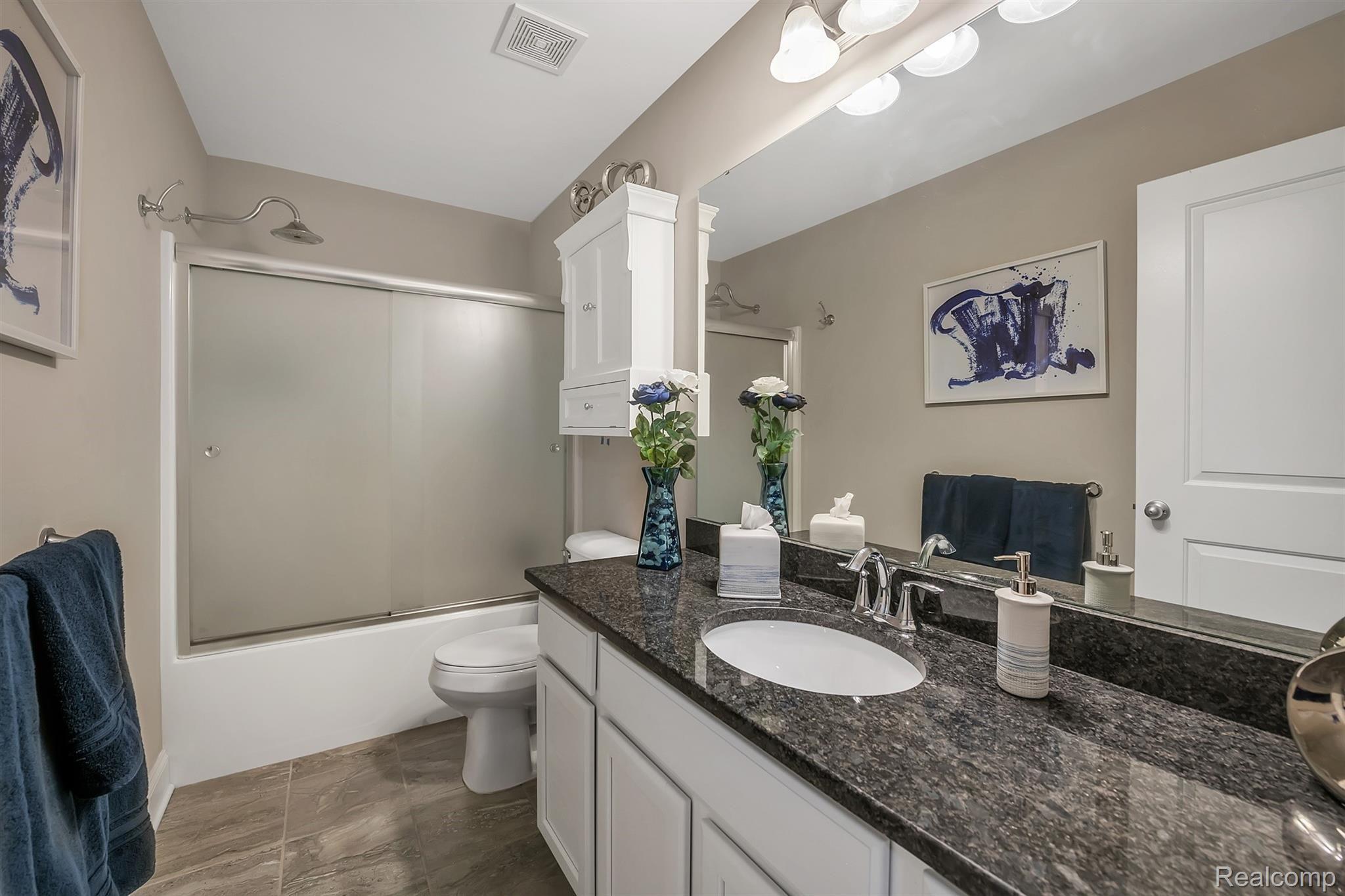147 Sedum Road Howell, MI 48843 - Photo 16 of 34 2nd Full Bathroom ~ Tub / Shower with Upgraded Shower Doors, Fixtures and Granite Countertops