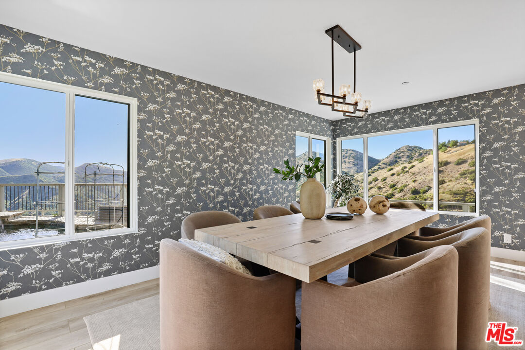 53 Saddlebow Road Bell Canyon, CA 91307 - Photo 13 of 66 a view of a dining room with a table and chairs
