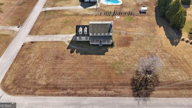 a view of swimming pool with an outdoor seating