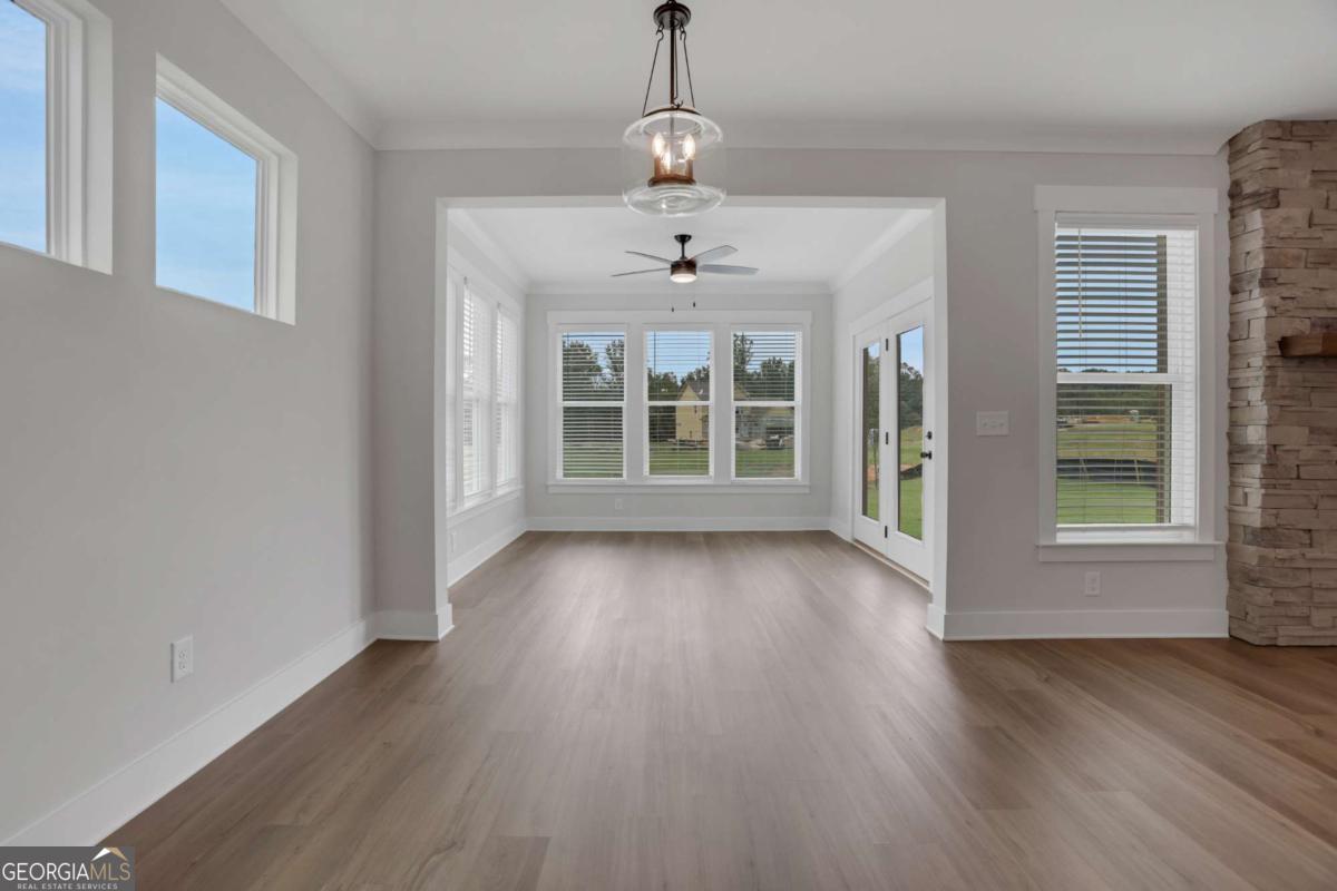 4230 Mary Ruth Way Loganville, GA 30052 - Photo 20 of 51 a view of an empty room with wooden floor and a window
