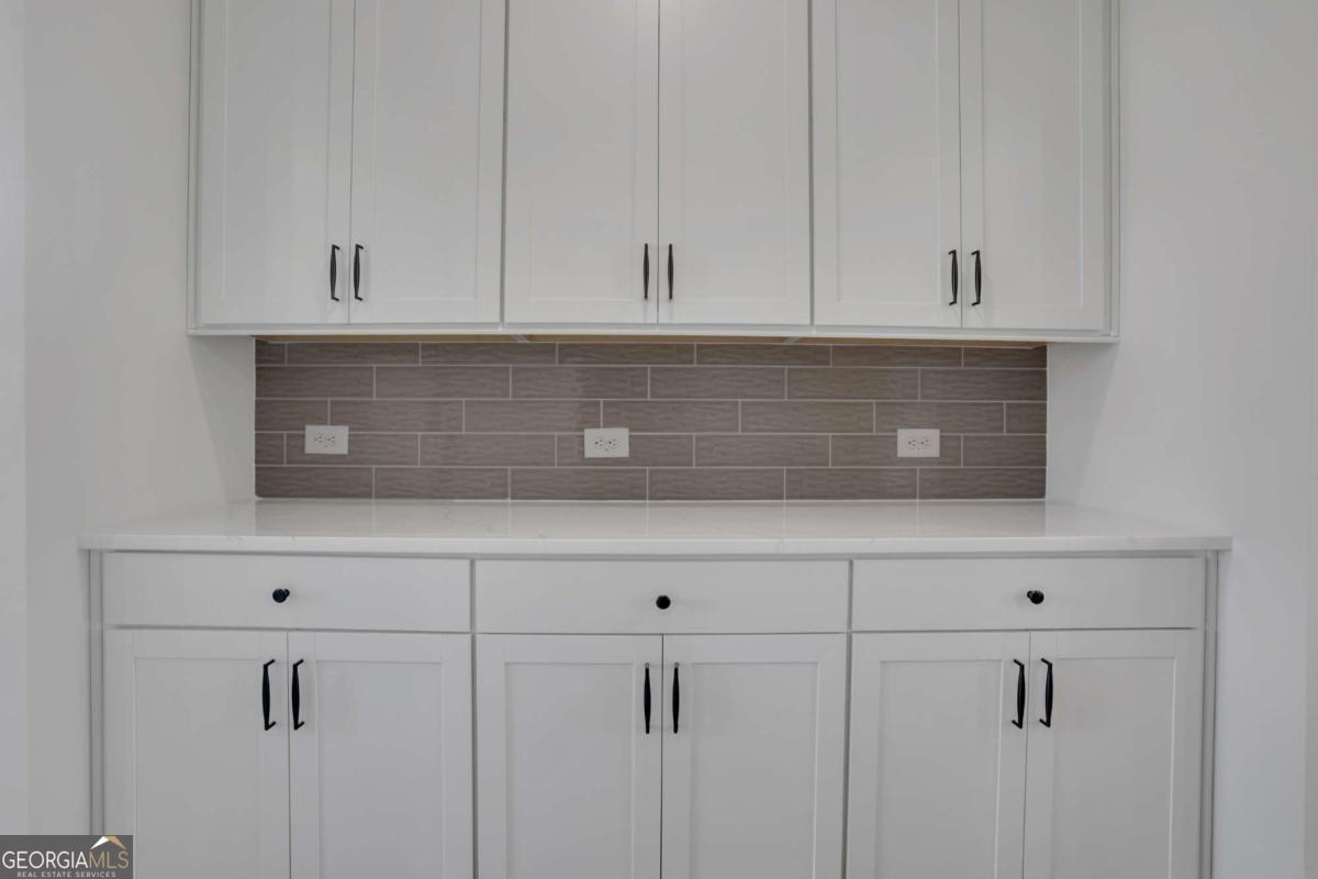 4230 Mary Ruth Way Loganville, GA 30052 - Photo 23 of 51 a view of white cabinets