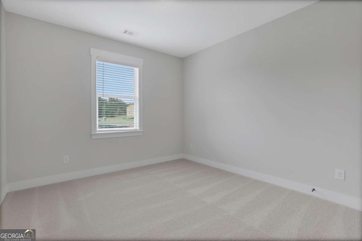 4230 Mary Ruth Way Loganville, GA 30052 - Photo 24 of 51 an empty room with a window