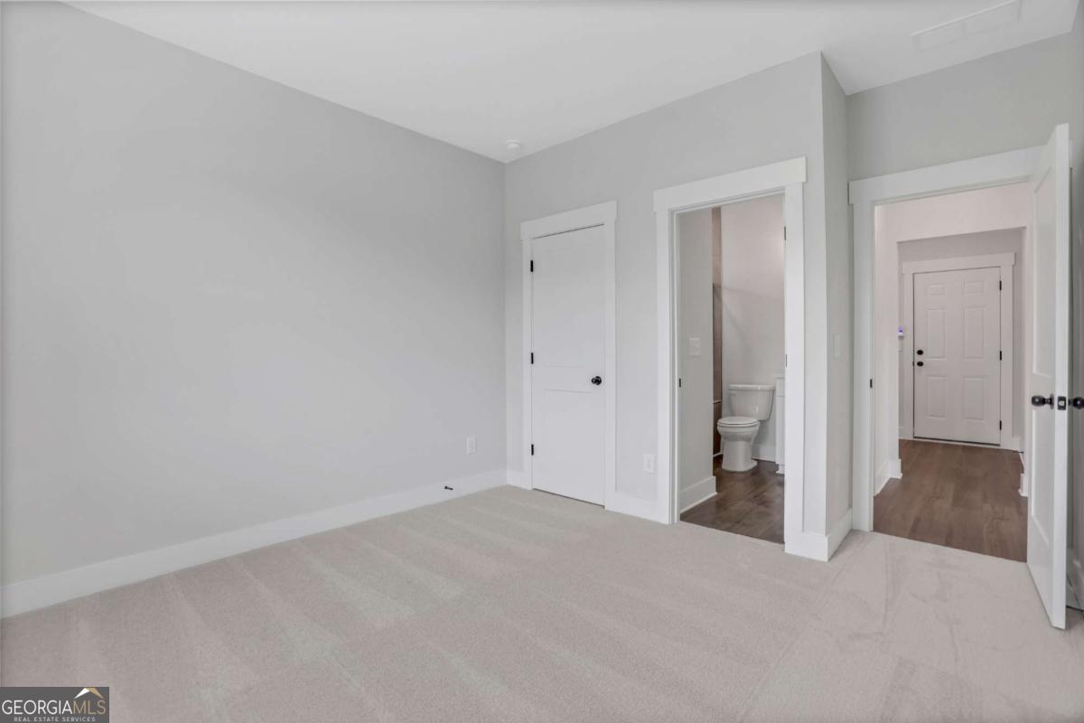 4230 Mary Ruth Way Loganville, GA 30052 - Photo 25 of 51 wooden floor and closet in an empty room