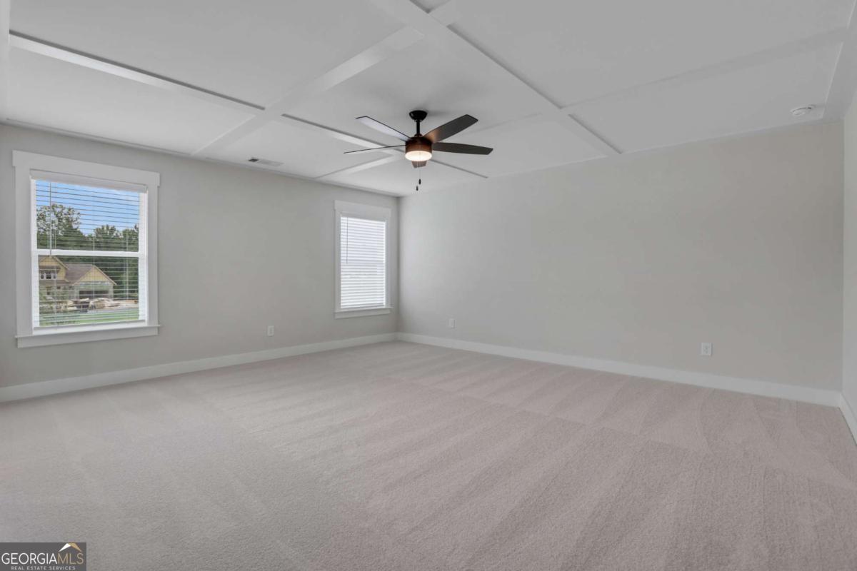 4230 Mary Ruth Way Loganville, GA 30052 - Photo 28 of 51 an empty room with windows and fan