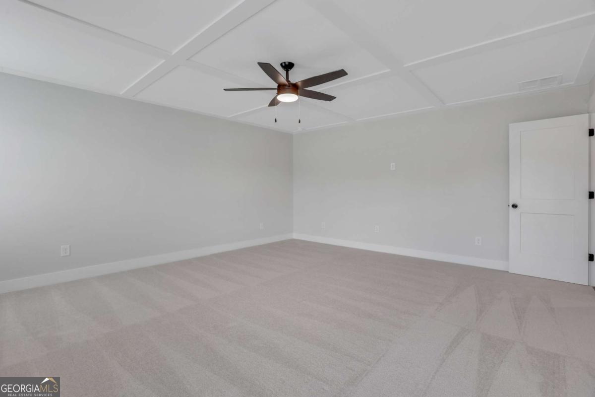 4230 Mary Ruth Way Loganville, GA 30052 - Photo 31 of 51 an empty room with a window and a ceiling fan