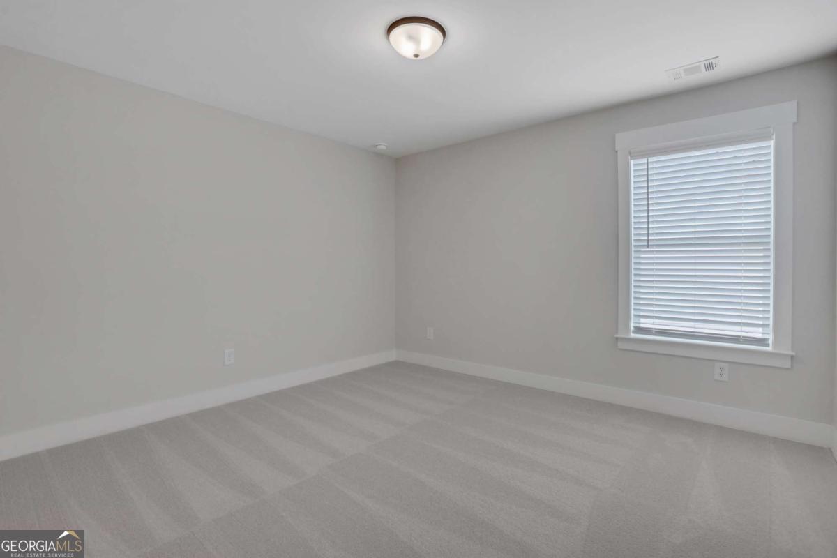 4230 Mary Ruth Way Loganville, GA 30052 - Photo 39 of 51 an empty room with a window