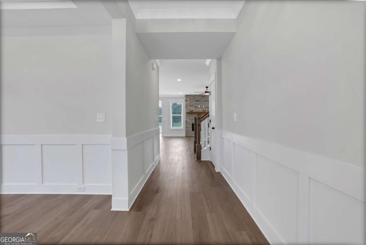 4230 Mary Ruth Way Loganville, GA 30052 - Photo 4 of 51 a view of a hallway with wooden floor and closet