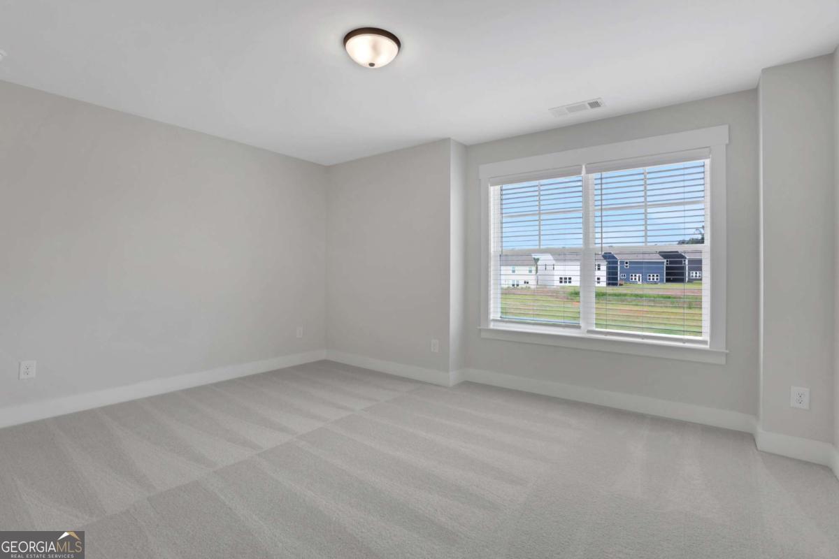 4230 Mary Ruth Way Loganville, GA 30052 - Photo 41 of 51 an empty room with a window