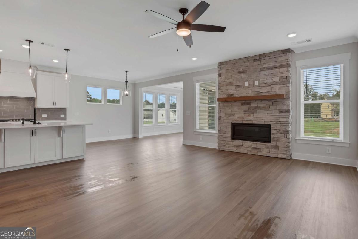 4230 Mary Ruth Way Loganville, GA 30052 - Photo 10 of 51 a view of a kitchen with a sink and a fireplace