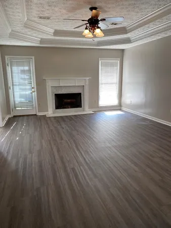 wooden floor fireplace and natural light