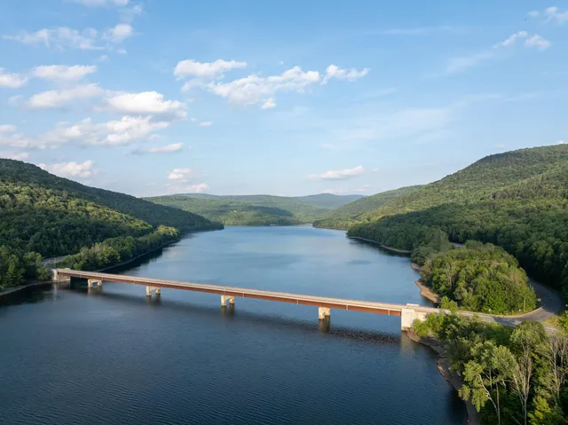 a view of street with green field