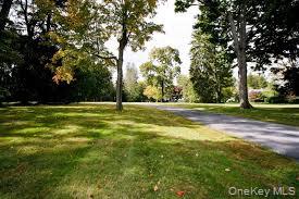 122 Lincoln Avenue Purchase, NY 10577 - Photo 2 of 4 a view of a field with trees in the background