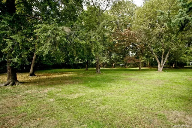 a view of outdoor space with deck and yard