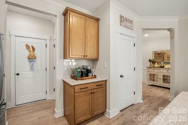 a view of a kitchen with refrigerator and cabinet