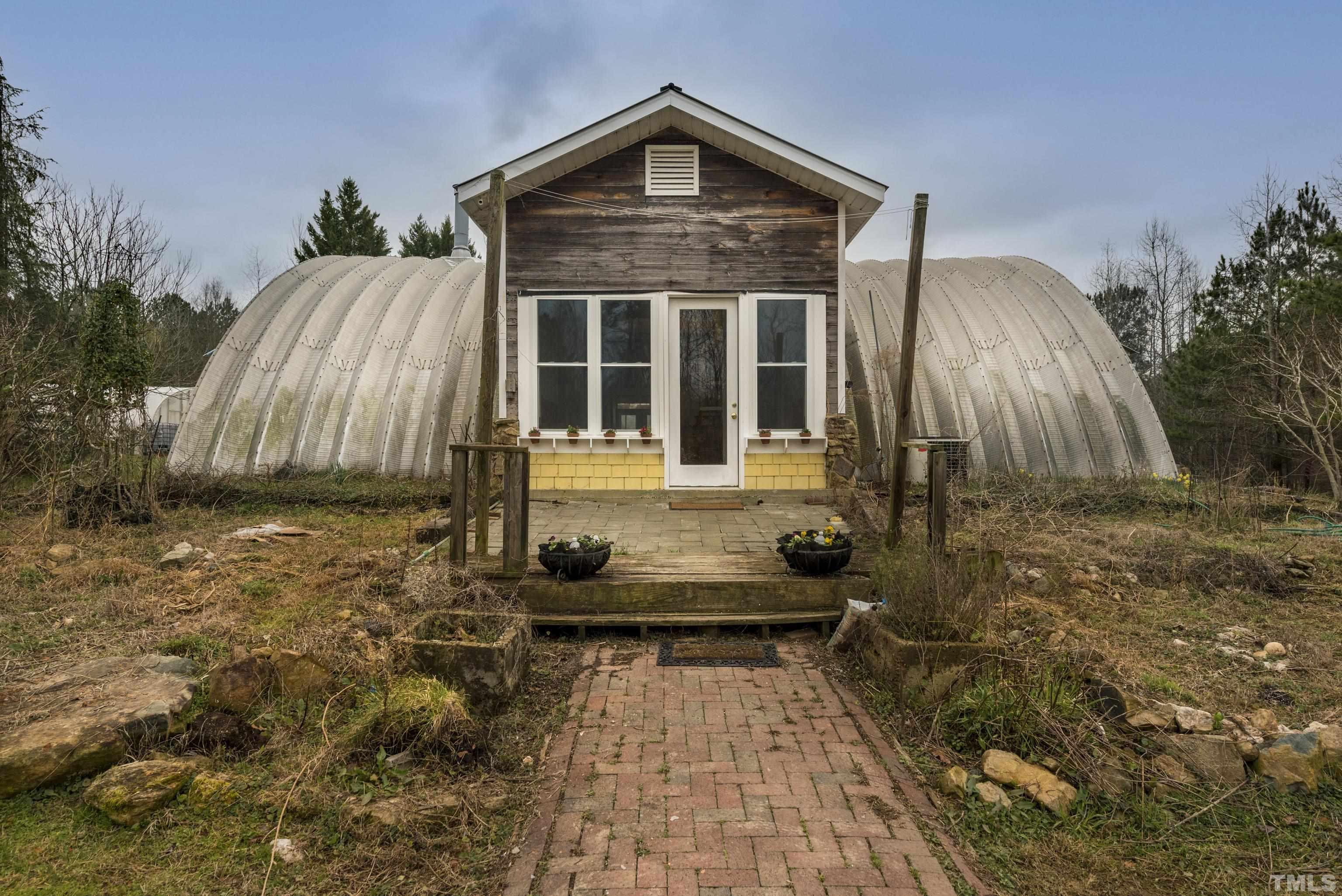 7409 Wiley Mangum Road Bahama, NC 27503 - Photo 1 of 20 a front view of a house with a yard