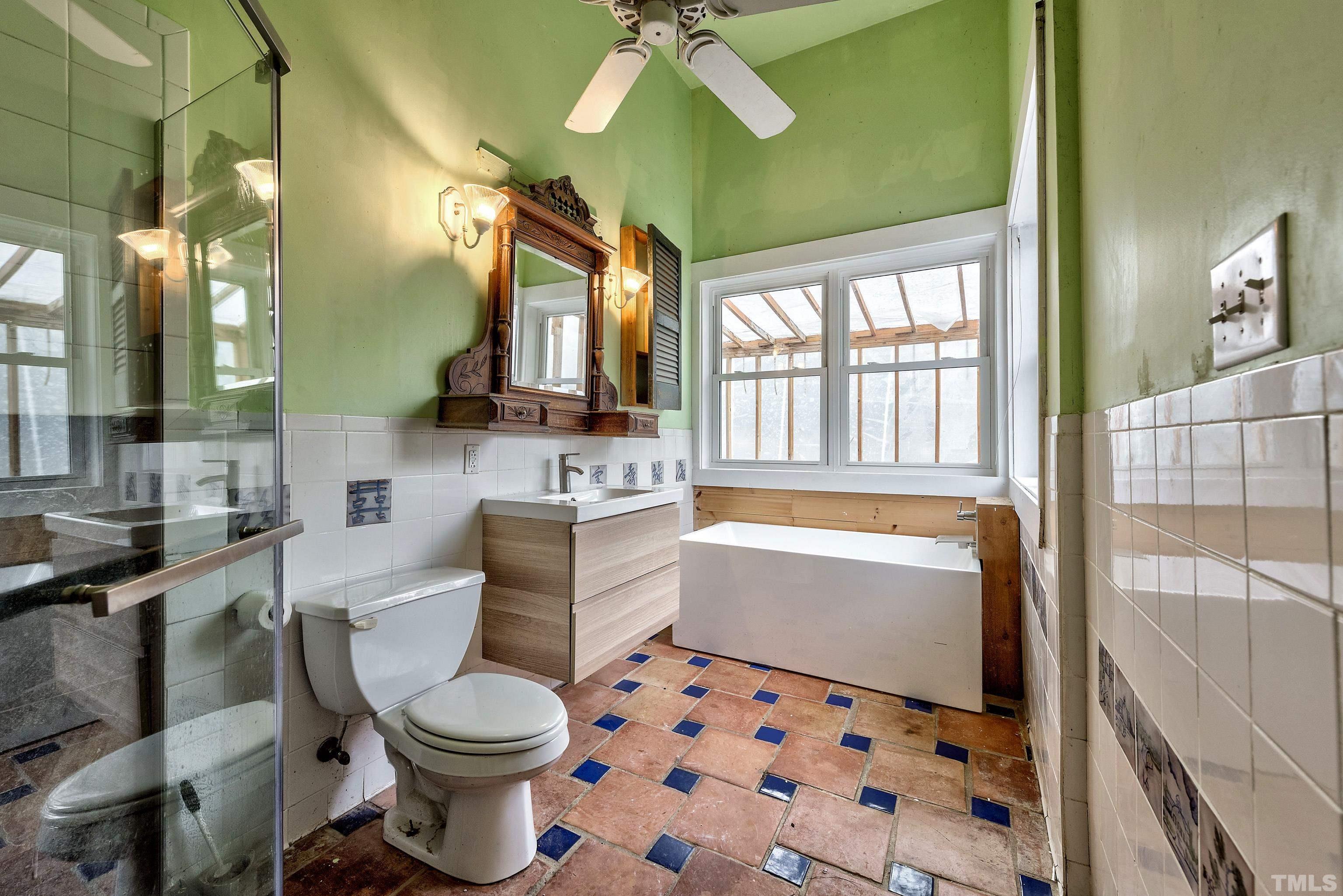 7409 Wiley Mangum Road Bahama, NC 27503 - Photo 18 of 20 a bathroom with a sink toilet and shower