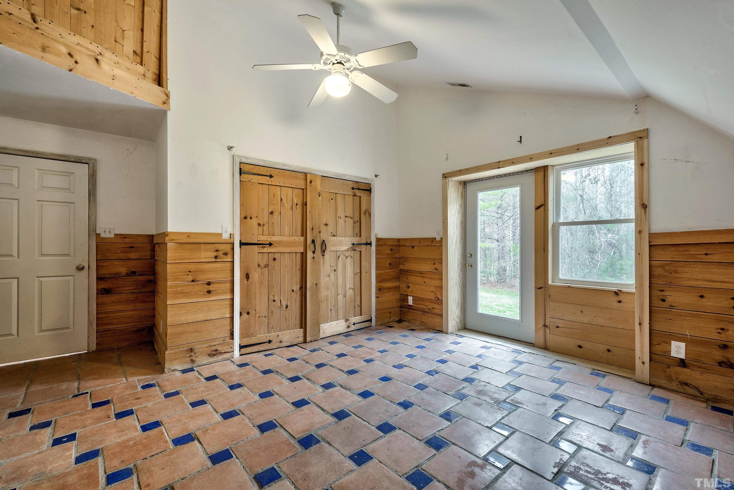 7409 Wiley Mangum Road Bahama, NC 27503 - Photo 20 of 20 a bedroom with a dresser and a chandelier