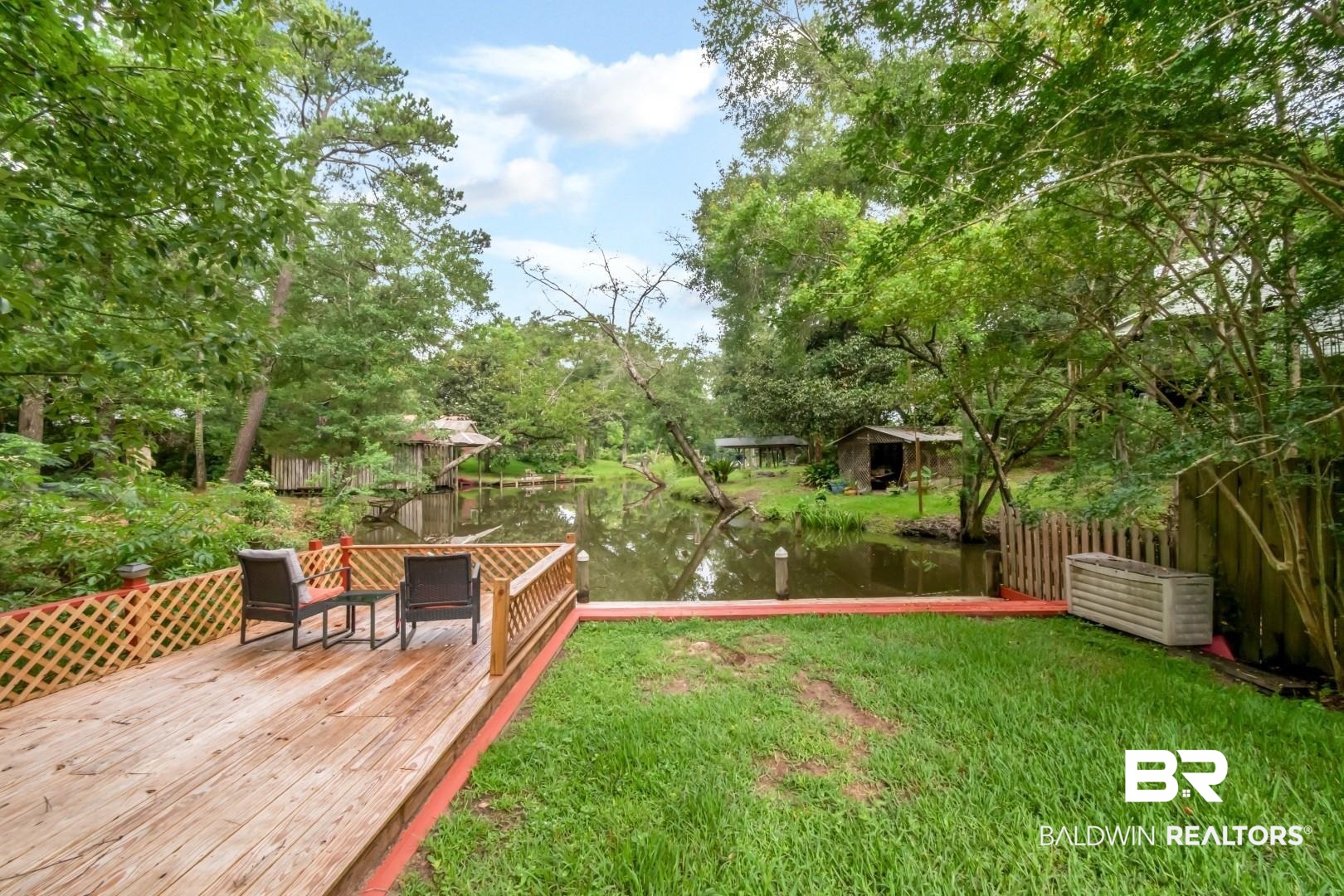 3212 Ward Road Mobile, AL 36605 - Photo 38 of 46 View of green lawn with a deck with water view