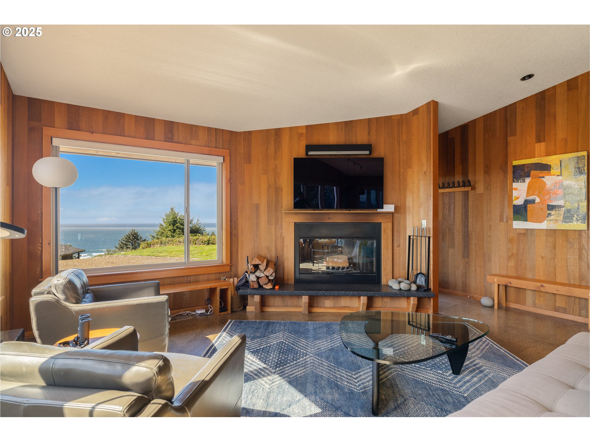 8455 San Dune Road Nehalem, OR 97131 - Photo 12 of 48 a living room with furniture and a fireplace