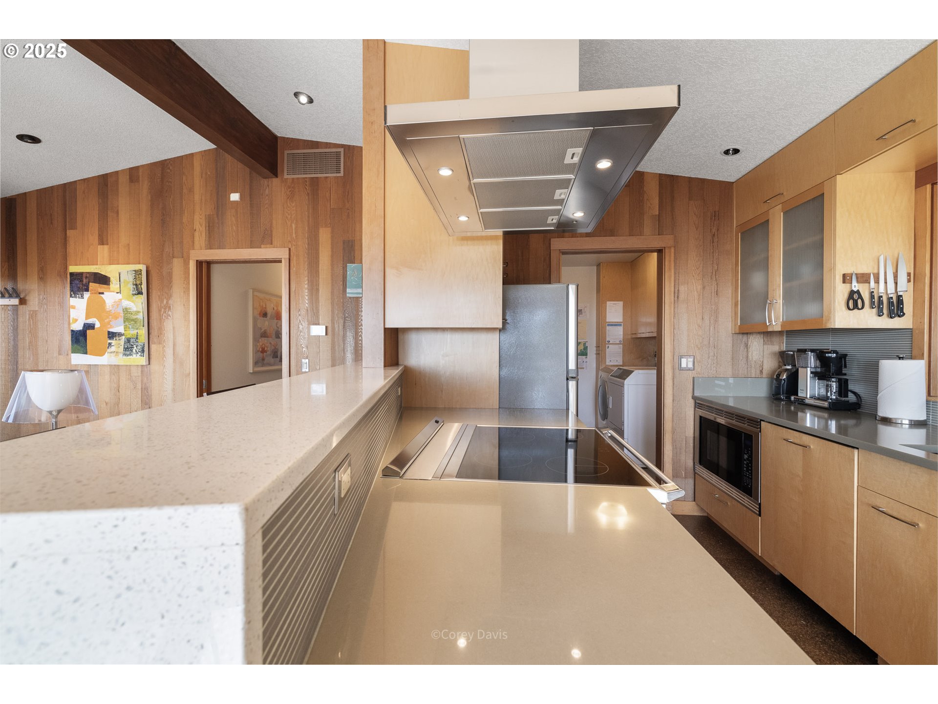 8455 San Dune Road Nehalem, OR 97131 - Photo 16 of 48 a kitchen with stainless steel appliances kitchen island granite countertop a refrigerator and a sink