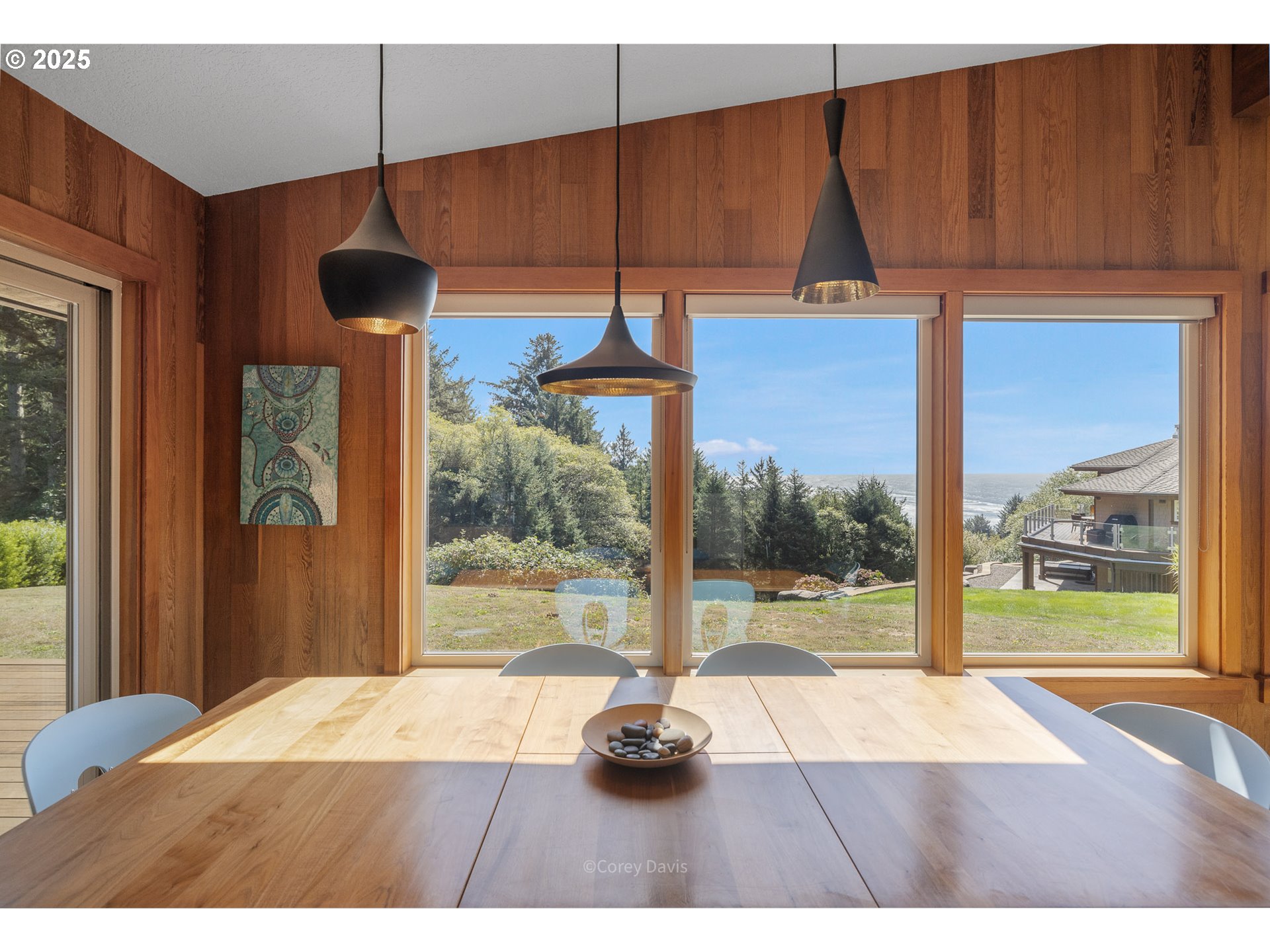 8455 San Dune Road Nehalem, OR 97131 - Photo 18 of 48 a room that has a bed and a large window