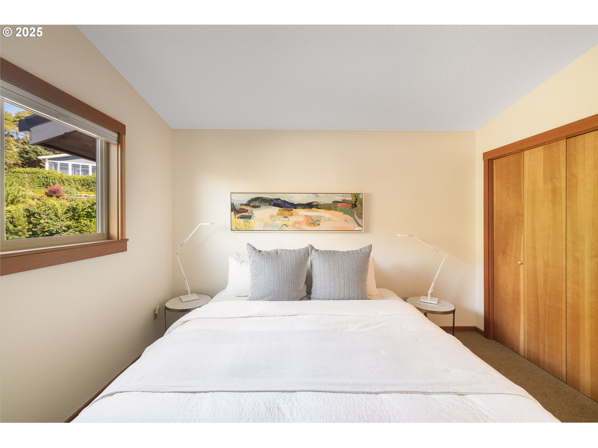 8455 San Dune Road Nehalem, OR 97131 - Photo 21 of 48 a bedroom with a bed and a window