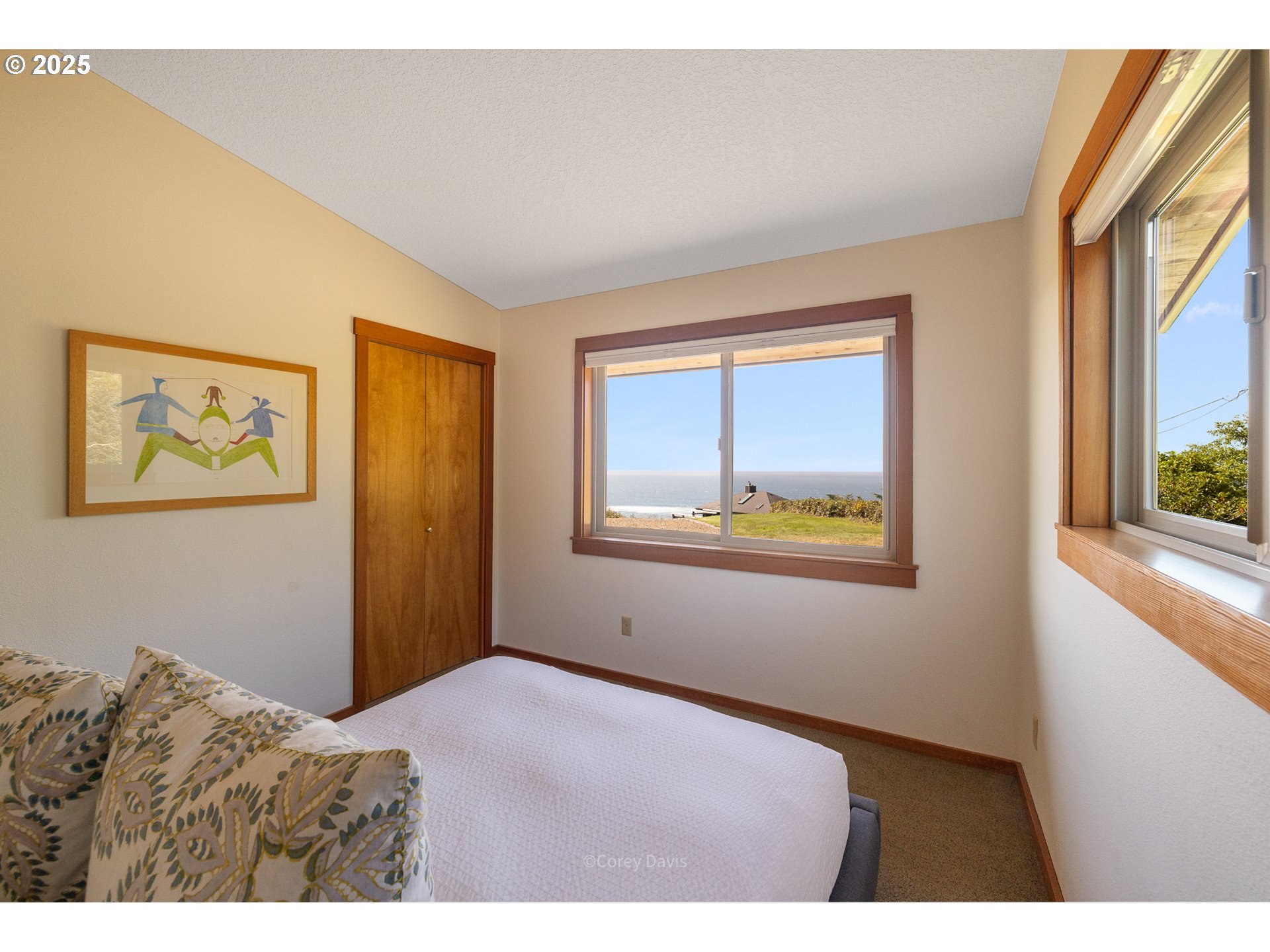 8455 San Dune Road Nehalem, OR 97131 - Photo 24 of 48 a bedroom with a bed and wooden floor