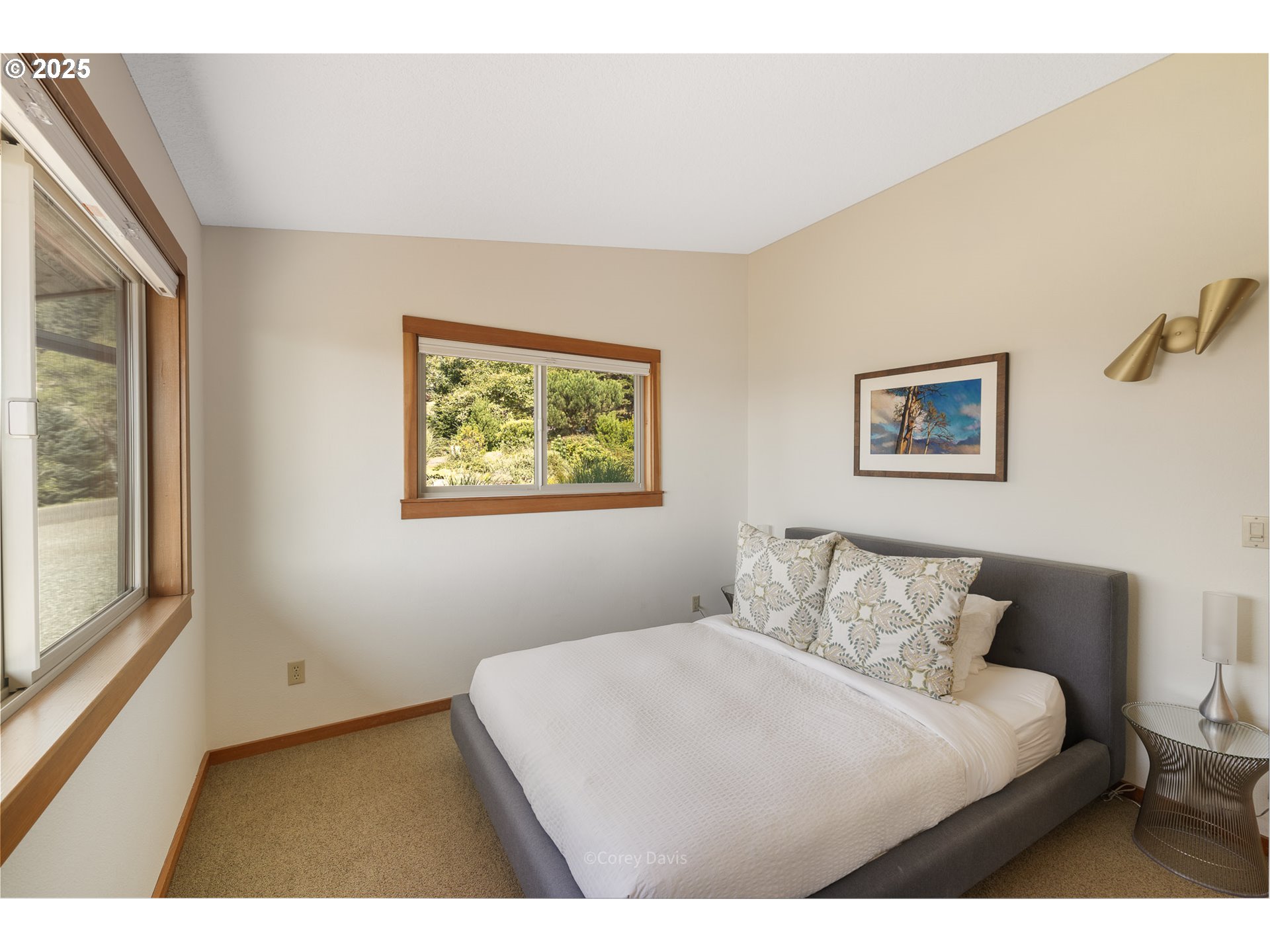 8455 San Dune Road Nehalem, OR 97131 - Photo 25 of 48 a bedroom with a bed and a large window