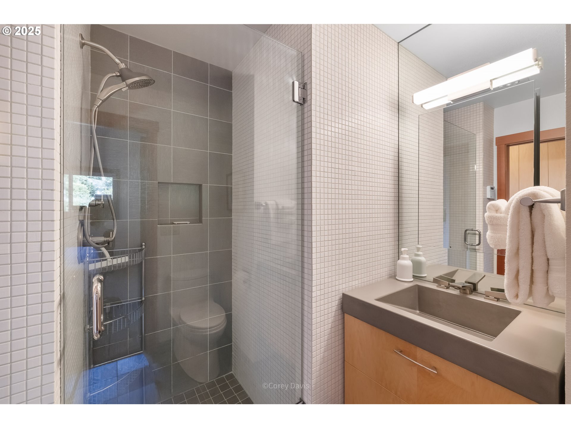 8455 San Dune Road Nehalem, OR 97131 - Photo 26 of 48 a bathroom with a sink mirror and shower