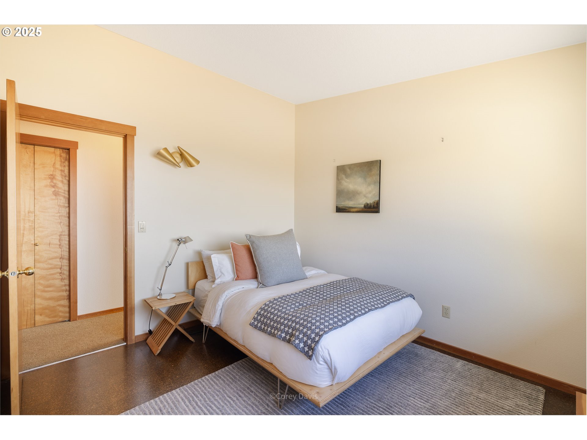 8455 San Dune Road Nehalem, OR 97131 - Photo 28 of 48 a bedroom with a bed and a night stand