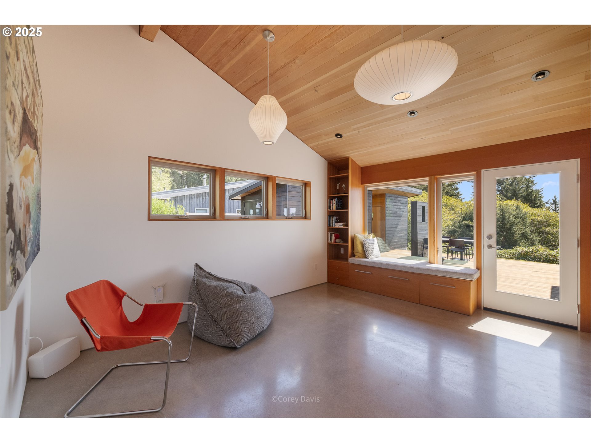 8455 San Dune Road Nehalem, OR 97131 - Photo 29 of 48 a living room with furniture and a large window