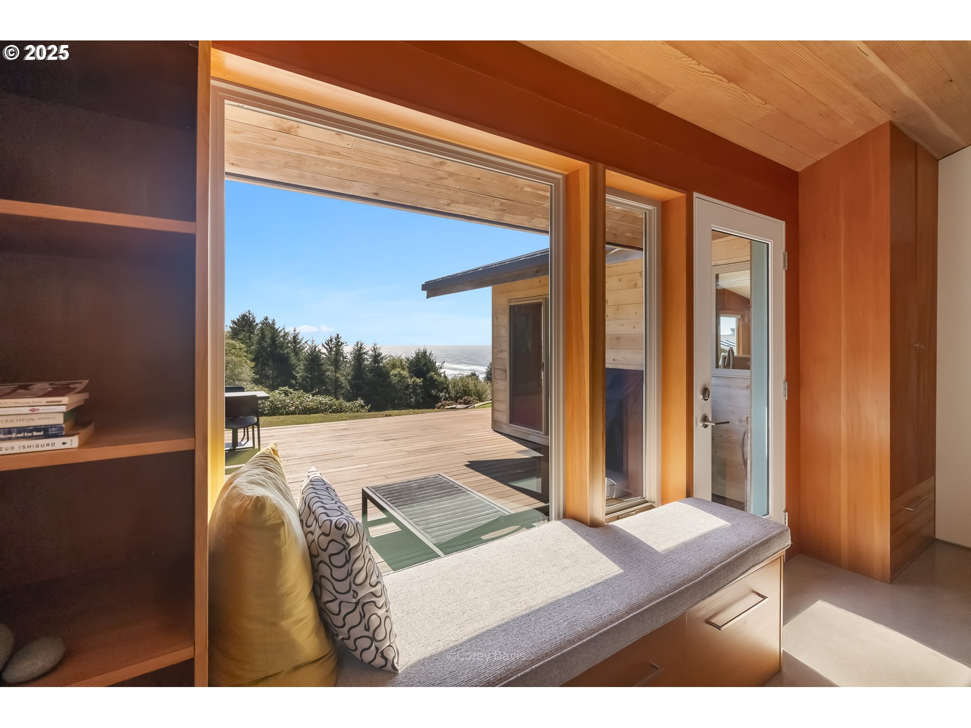 8455 San Dune Road Nehalem, OR 97131 - Photo 30 of 48 a balcony with furniture and a window