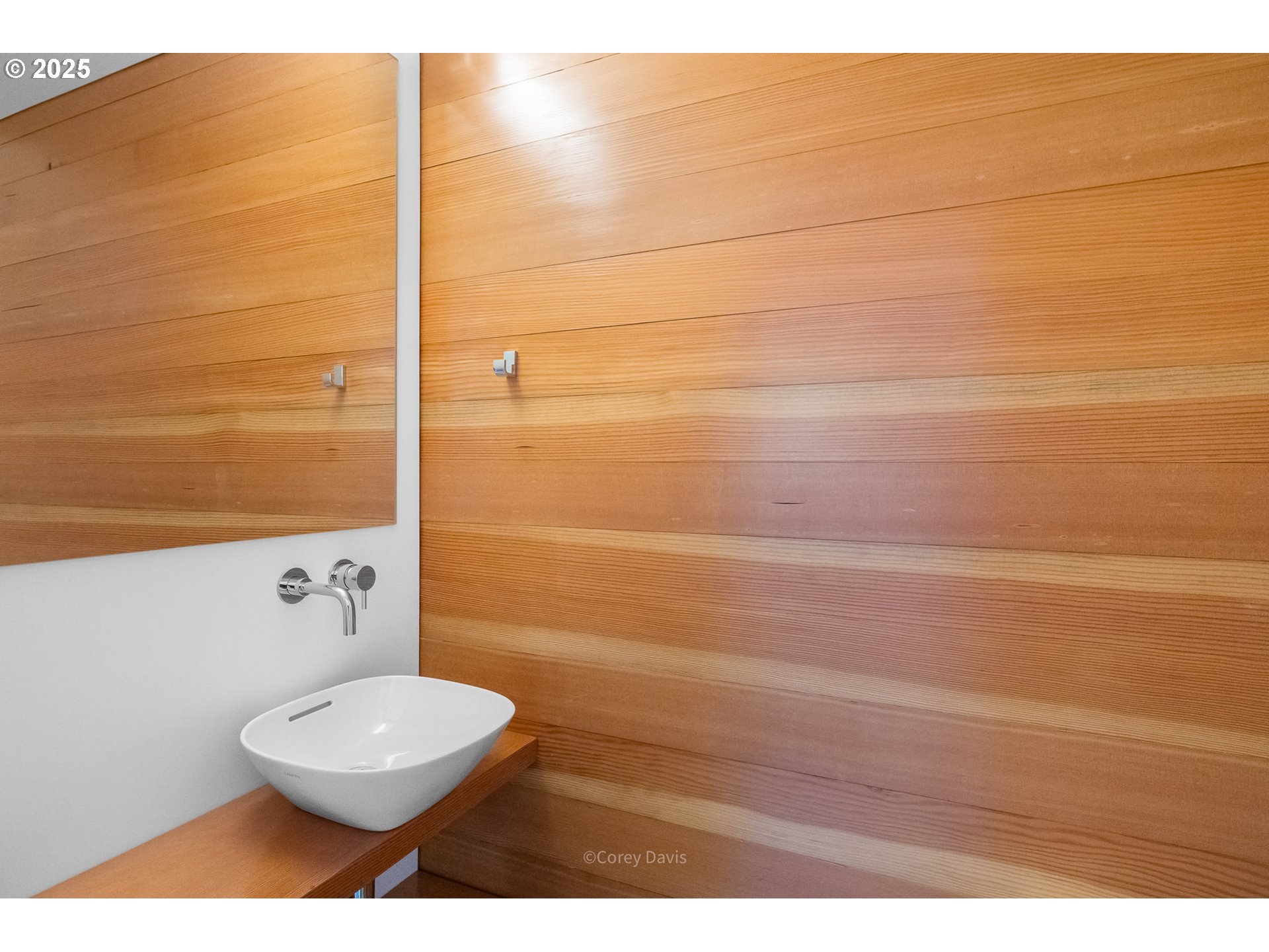 8455 San Dune Road Nehalem, OR 97131 - Photo 32 of 48 a bathroom with a toilet a sink and mirror