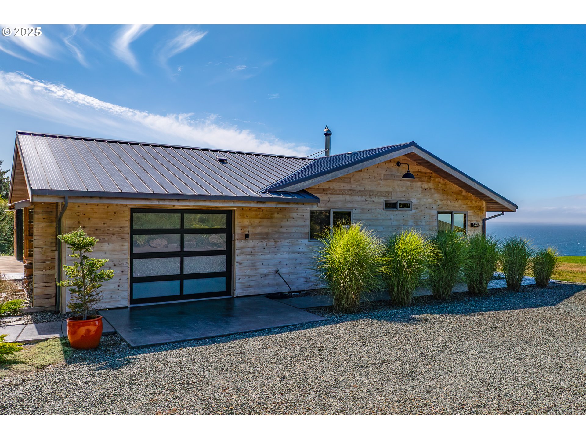 8455 San Dune Road Nehalem, OR 97131 - Photo 36 of 48 a front view of a house with garden