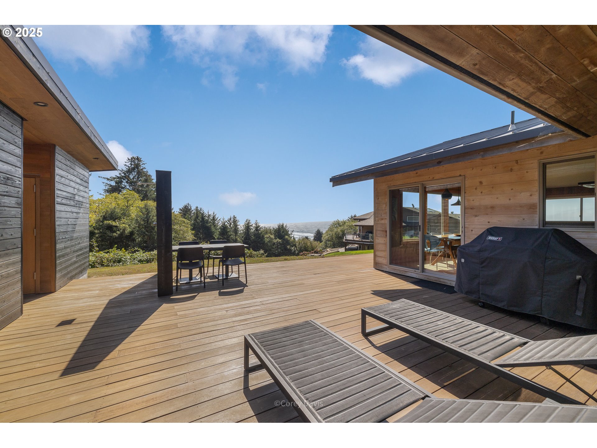8455 San Dune Road Nehalem, OR 97131 - Photo 41 of 48 a view of sitting area with furniture and floor to ceiling window