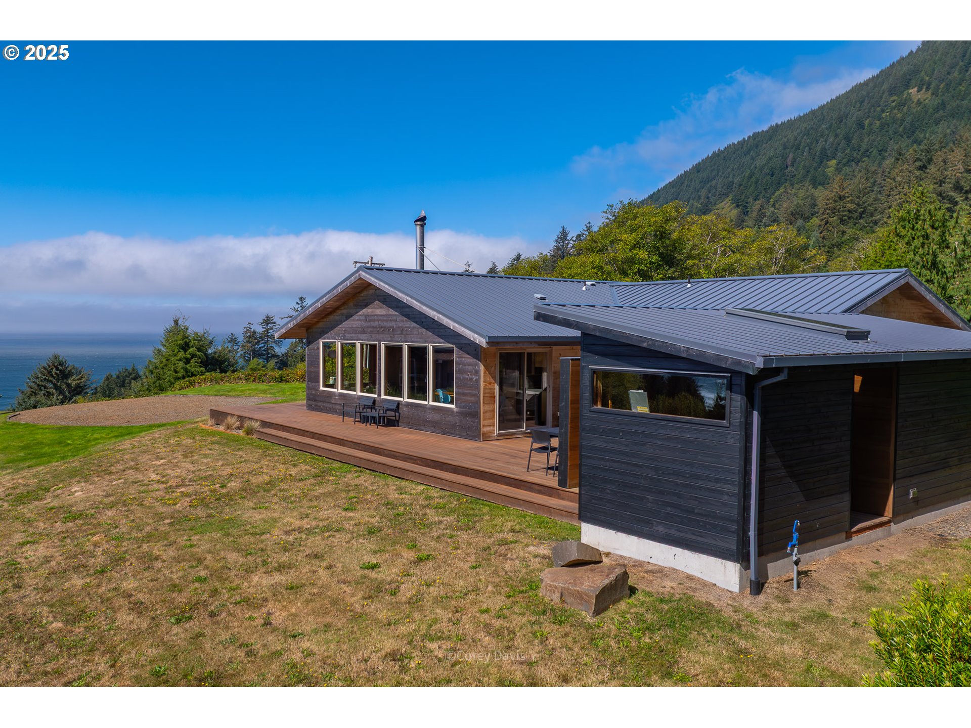 8455 San Dune Road Nehalem, OR 97131 - Photo 42 of 48 a house view with a garden space