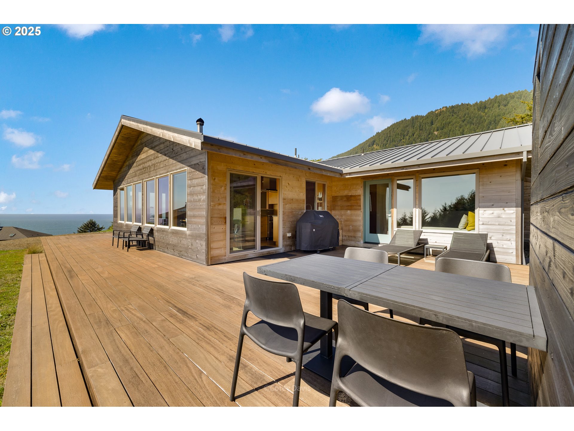 8455 San Dune Road Nehalem, OR 97131 - Photo 44 of 48 a view of a dining room with furniture and a chandelier