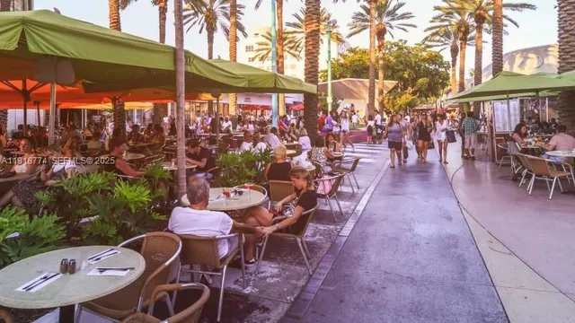 a group of people sitting outside of a house