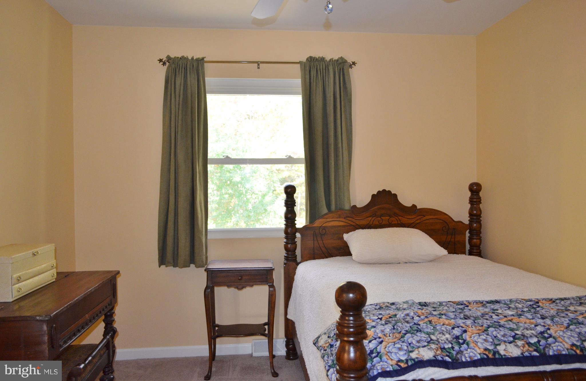 1365 Moyer Road Annapolis, MD 21403 - Photo 13 of 23 a bedroom with a bed and a window