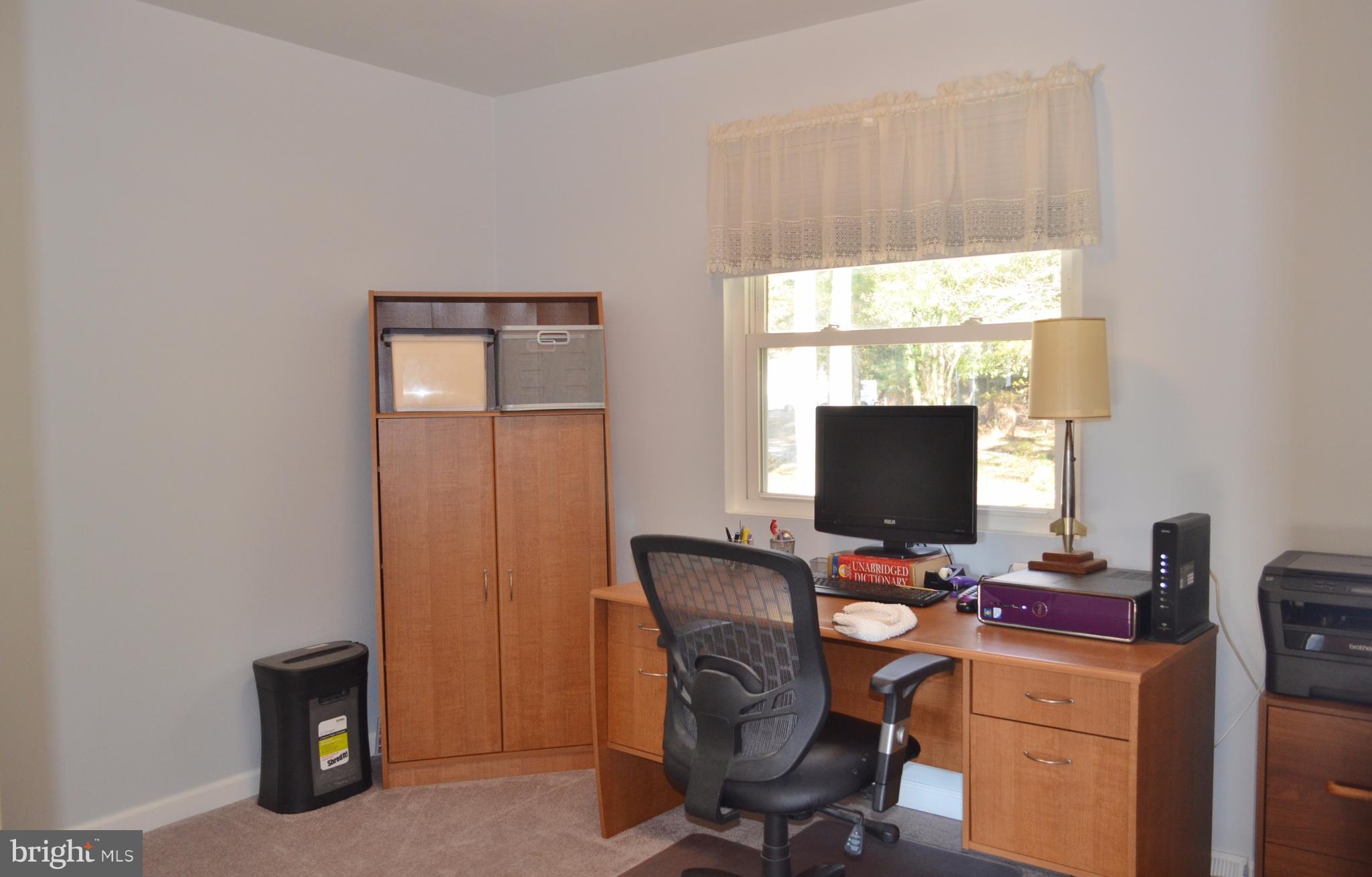 1365 Moyer Road Annapolis, MD 21403 - Photo 14 of 23 a view of a workspace with furniture and a window