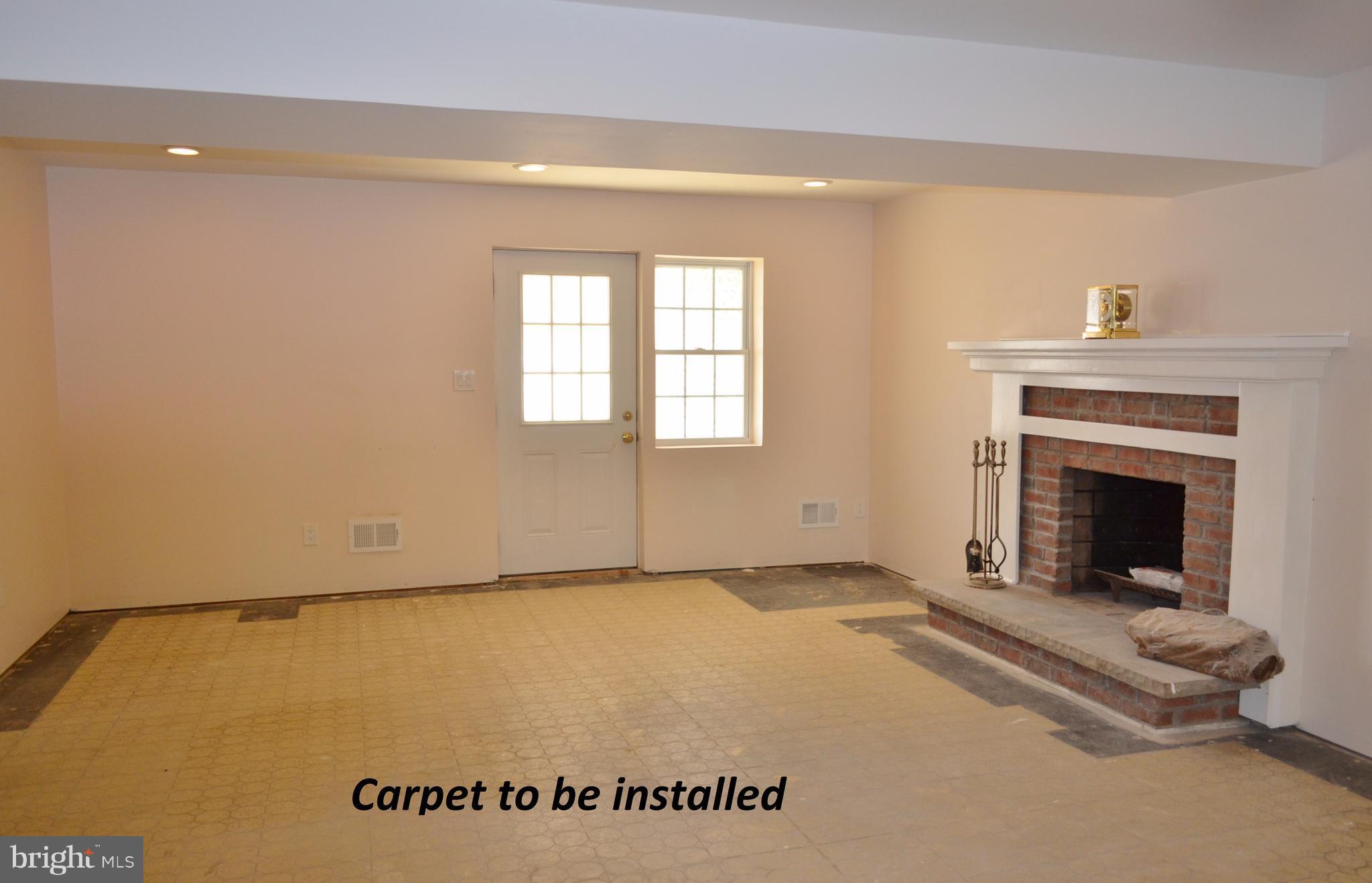 1365 Moyer Road Annapolis, MD 21403 - Photo 16 of 23 a view of an empty room with a fireplace
