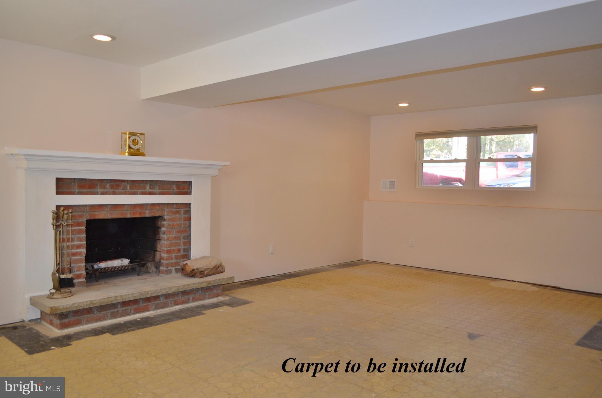 1365 Moyer Road Annapolis, MD 21403 - Photo 17 of 23 a view of an empty room with a fireplace