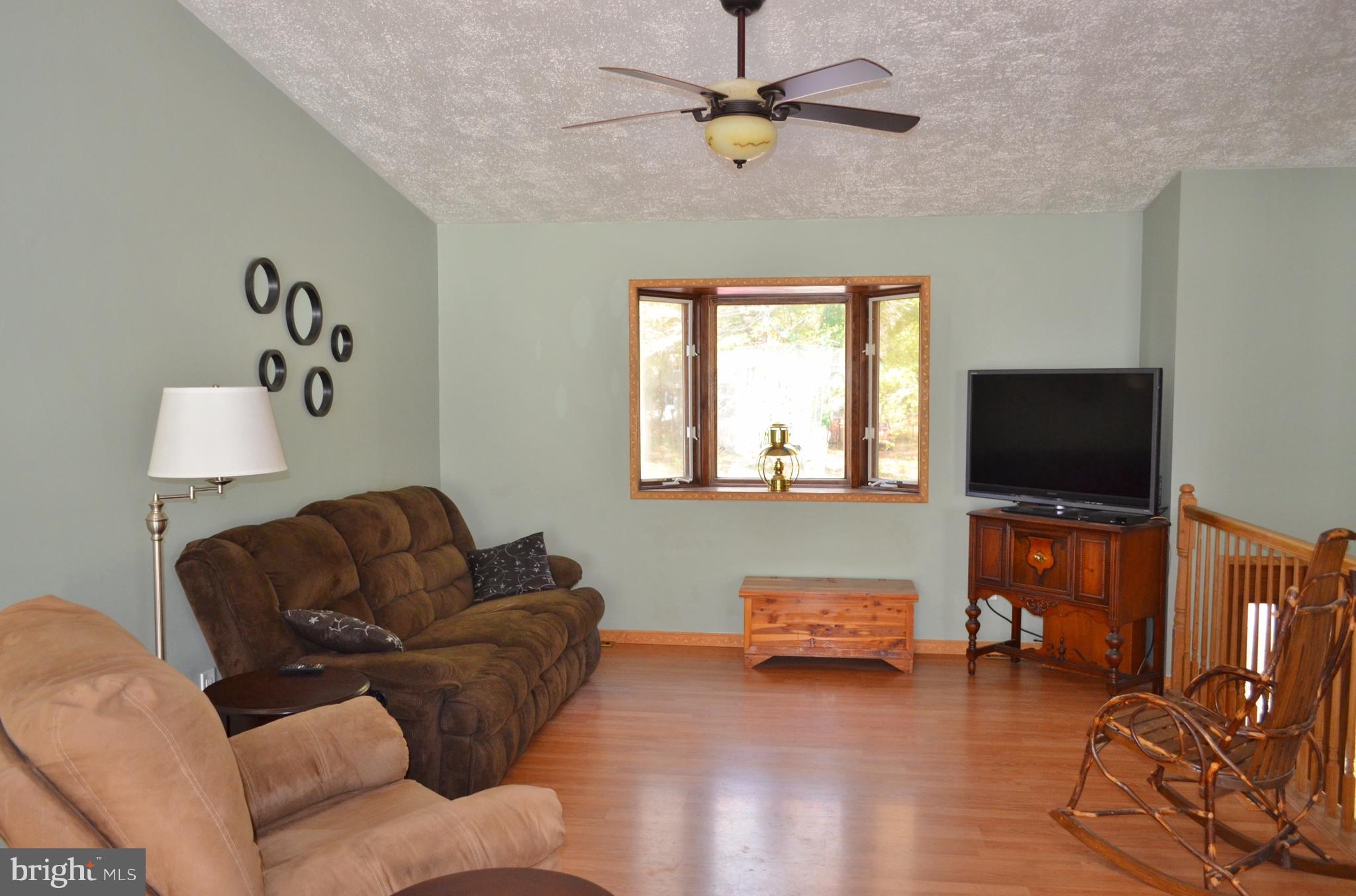1365 Moyer Road Annapolis, MD 21403 - Photo 4 of 23 a living room with furniture and a flat screen tv
