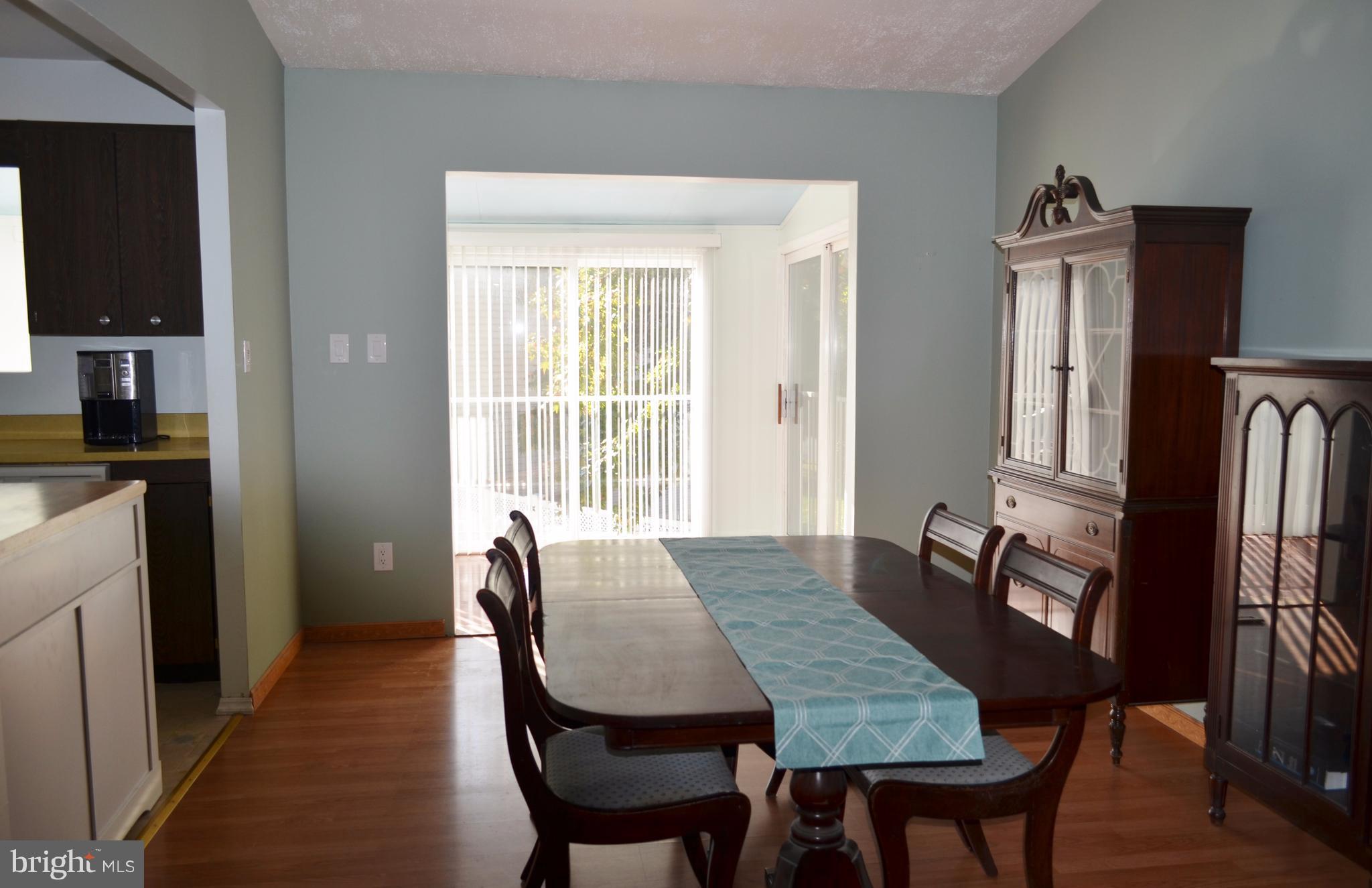 1365 Moyer Road Annapolis, MD 21403 - Photo 7 of 23 a view of a dining room with furniture and a window