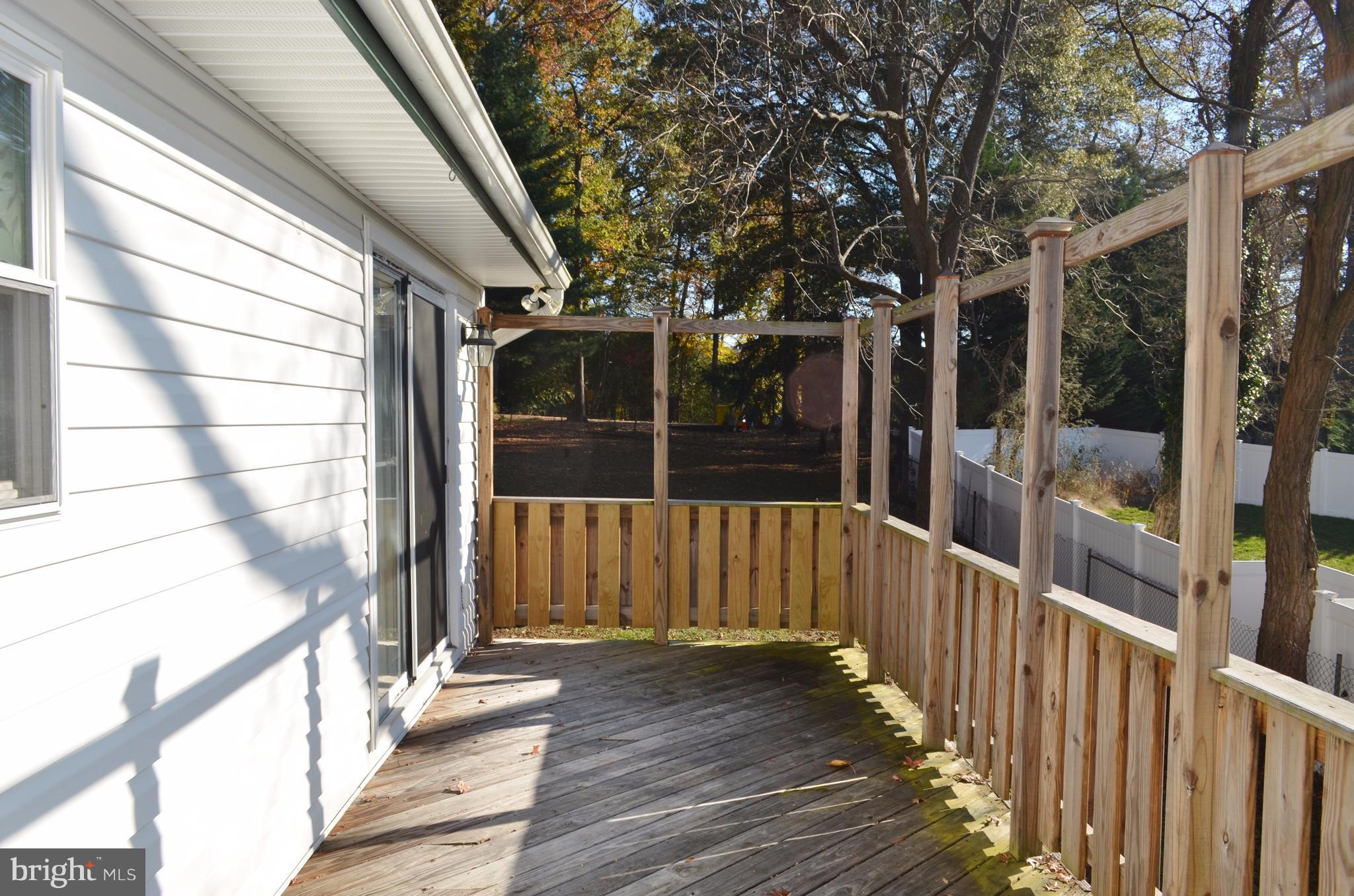 1365 Moyer Road Annapolis, MD 21403 - Photo 9 of 23 a view of a porch with wooden floor and fence