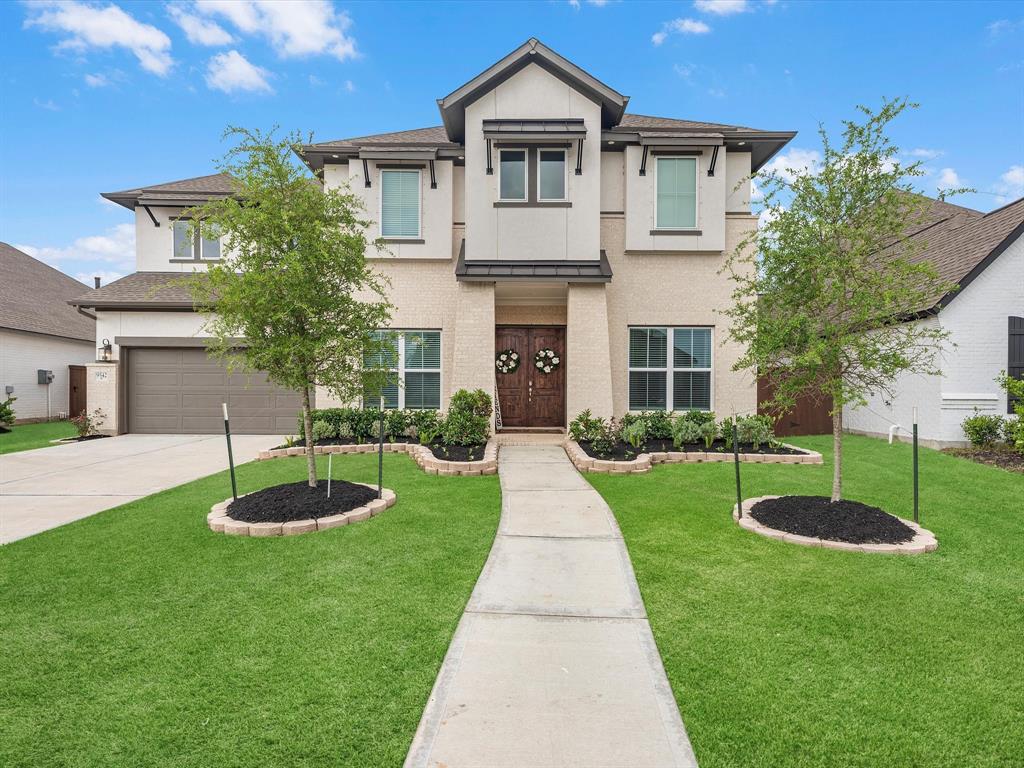 Welcome home to 9542 Wilder Road! Discover the perfect blend of modern design and serene surroundings in this stunning home’s brick and stucco elevation.