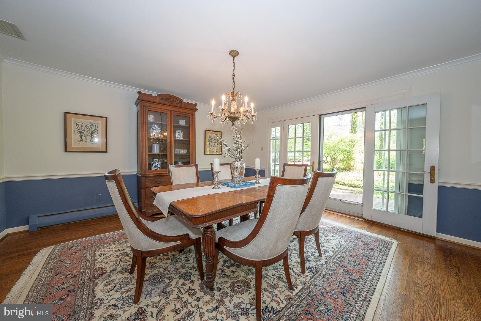 340 Chester Road Devon, PA 19333 - Photo 13 of 48 a dining room with furniture a chandelier and wooden floor