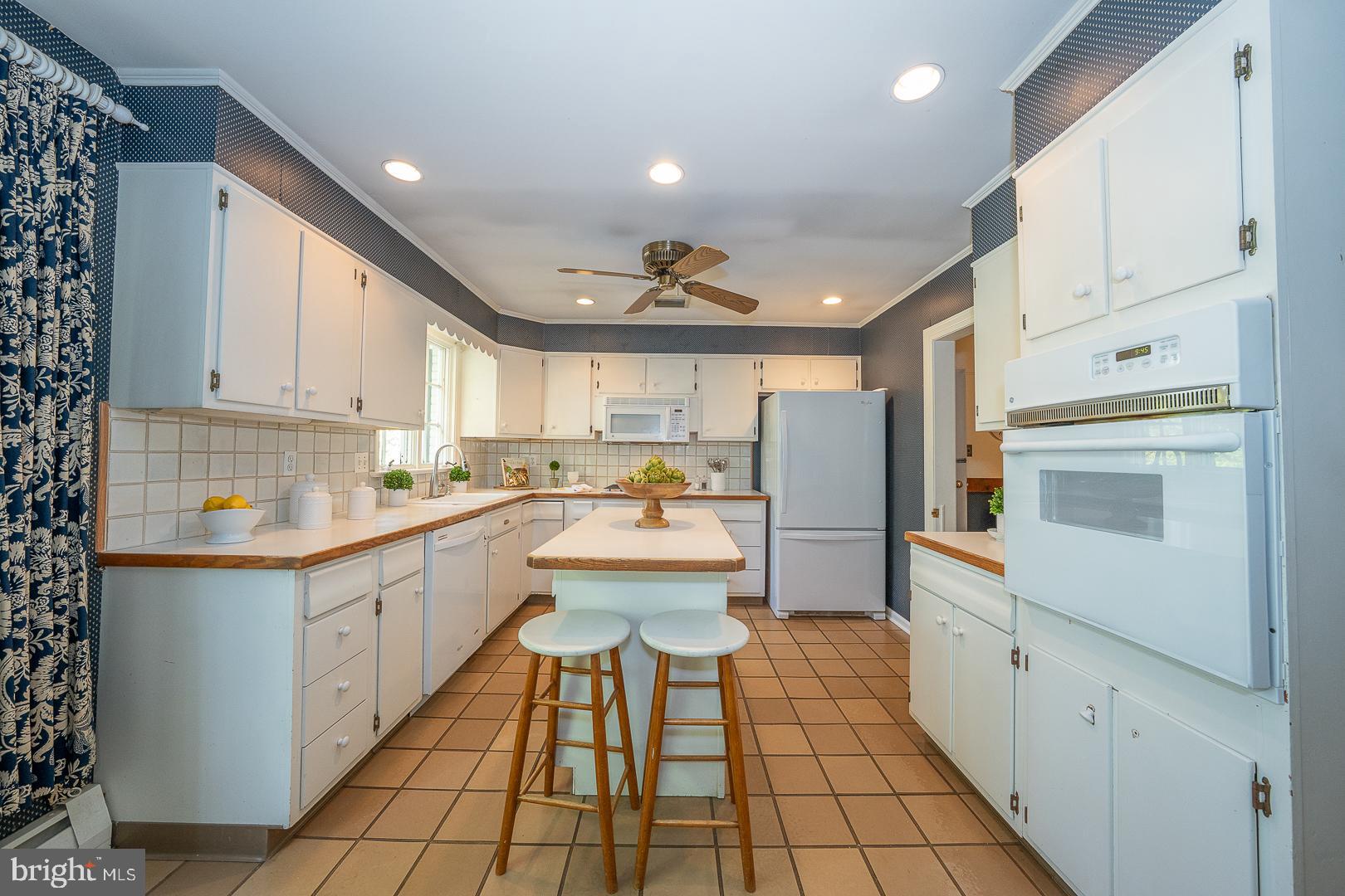 340 Chester Road Devon, PA 19333 - Photo 17 of 48 a kitchen with a sink cabinets and stainless steel appliances